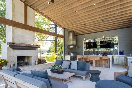 Full Outdoor Kitchen with Stone Fireplace